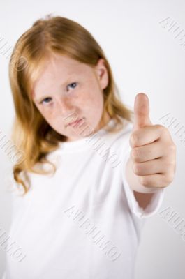 cute little girl with thumb up (focus on thumb)