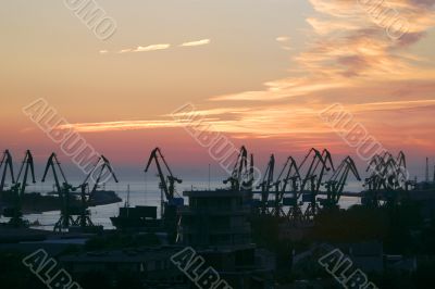 Shipyard cranes in the sunset time