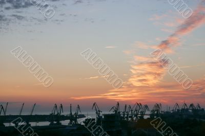 Shipyard cranes in the sunset time