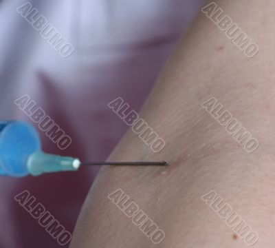 Portrait of a young doctor with syringa.