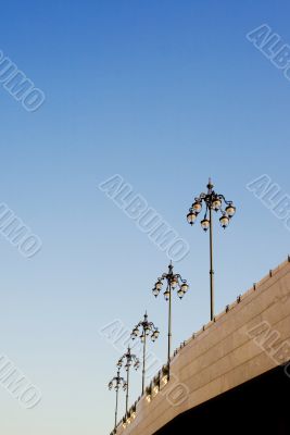 Several lamp posts on sky background