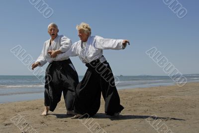 training of Aikido on the beach