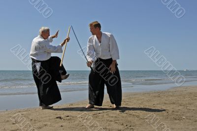 training of Aikido on the beach