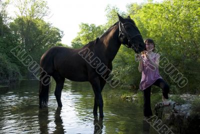 child and horse in river