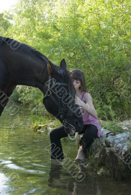 child and horse in river
