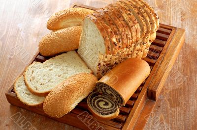 assortment of baked bread and other bakery products