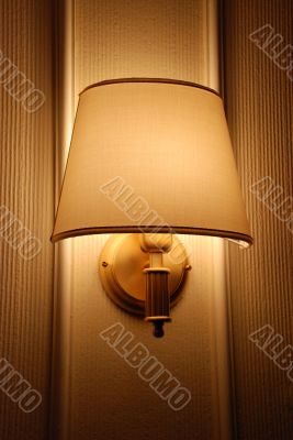Bright lamp on hotel wall