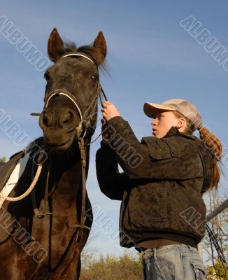 teenager, bridle and horse
