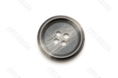 sewing button on white