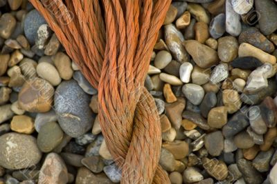 Rope on a pebble beach Rope on a pebble beach