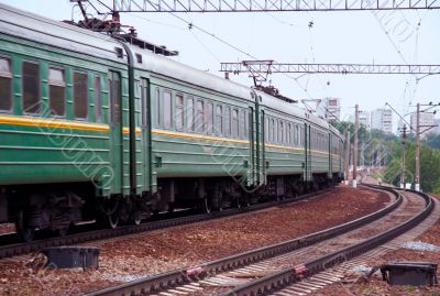 Cars of passing by passenger electric train