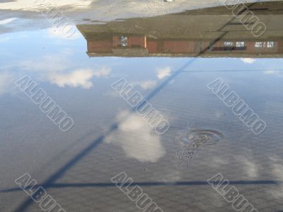 barn reflection in a puddle