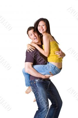 loving couple in denim play during their photo shoot