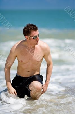 caucasian hunk at the beach with shades