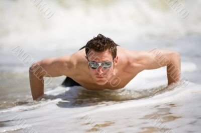 guy getting up from the beach guy getting up from the beach