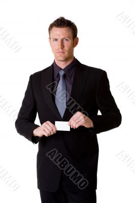 caucasian businessman in formal attire showing business card