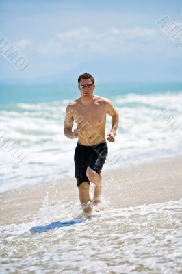 caucasian man running on the beach