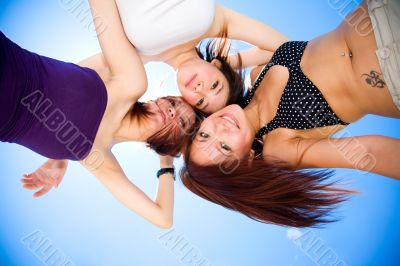 girls having fun under sunny blue sky