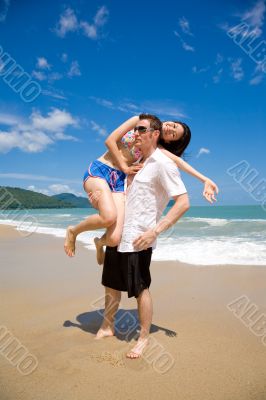 lovers having fun at the beach