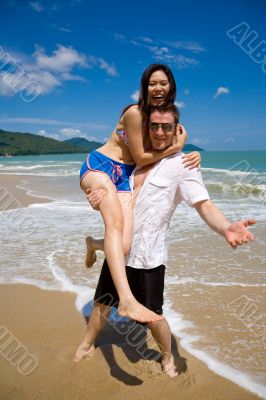 lovers having fun at the beach lovers having fun at the beach