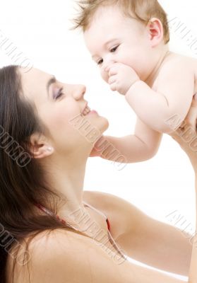 blue-eyed baby in mother hands