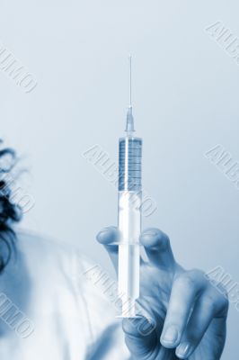 Portrait of a young doctor with syringa.