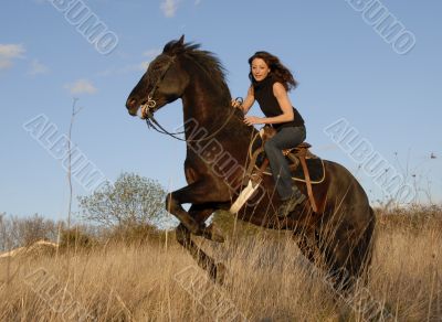 rearing stallion and girl