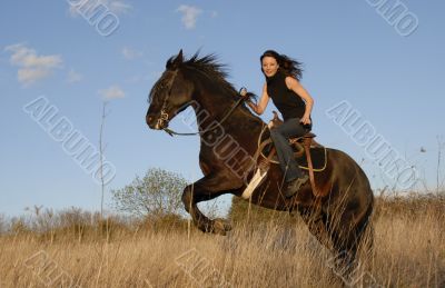 rearing stallion and girl