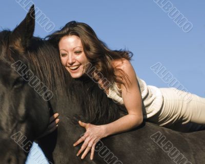 laughing woman and stallion