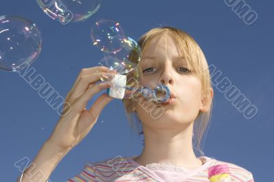 Girl blowing blow bubbles