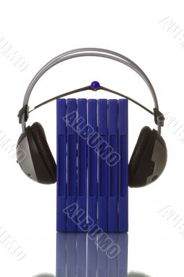 headphones holding blue dvd cases