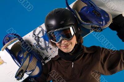 Woman with long curly hair with snowboard in her neck