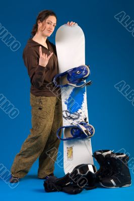 Woman with long curly hair giving a hang loose