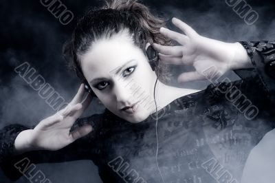 Woman with long curly hair listening