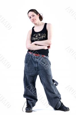 Woman with long curly hair in baggy clothes