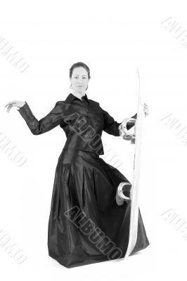 Woman with long curly hair, gala dress and snowboard Woman with long curly hair, gala dress and snowboard
