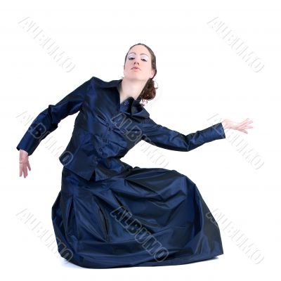 Woman with long curly hair posing in a gala dress