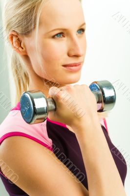 Girl holds barbell