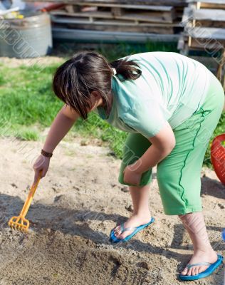 Girl Playing In Sand Girl Playing In Sand