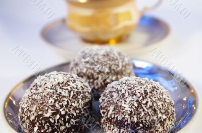 Cup of coffee and sweet with a coco