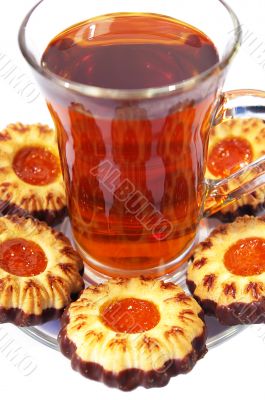 Cookies whith jelly and tea on a white background Cookies whith jelly and tea on a white background