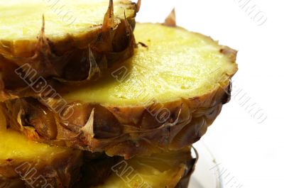 Pineapple cut on a part on a white background