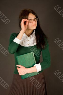 Businesswoman holding her glasses Businesswoman holding her glasses