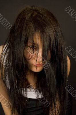 Sensual girl looking through hair