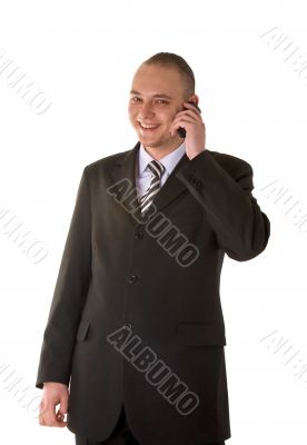 Laughing businessman calling on phone