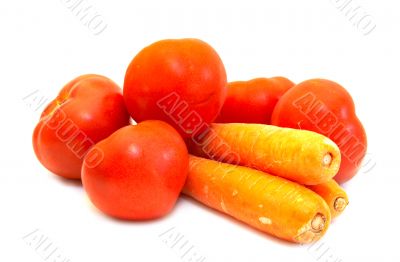 Juicy tomatos with carrot close-up Juicy tomatos with carrot close-up