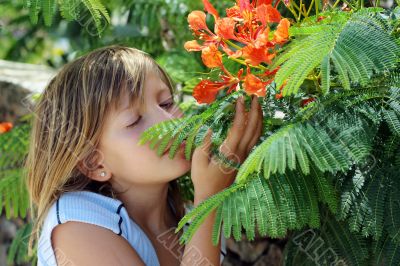 Little girl and  colorful flowers