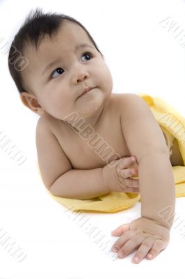 Sweet baby with a yellow blanket