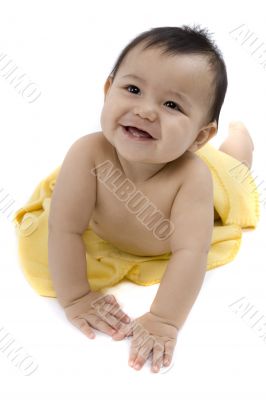 Sweet baby with a yellow blanket