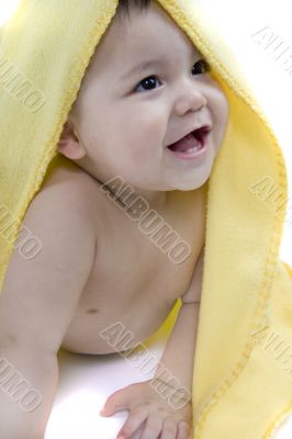 Sweet baby with a yellow blanket